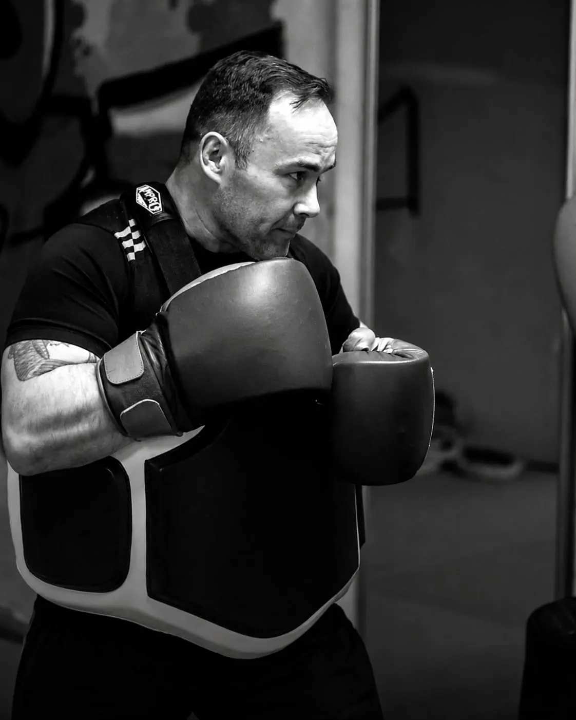 Arena Boxing Club coach and chairman Les Simmons leading a body pad training session