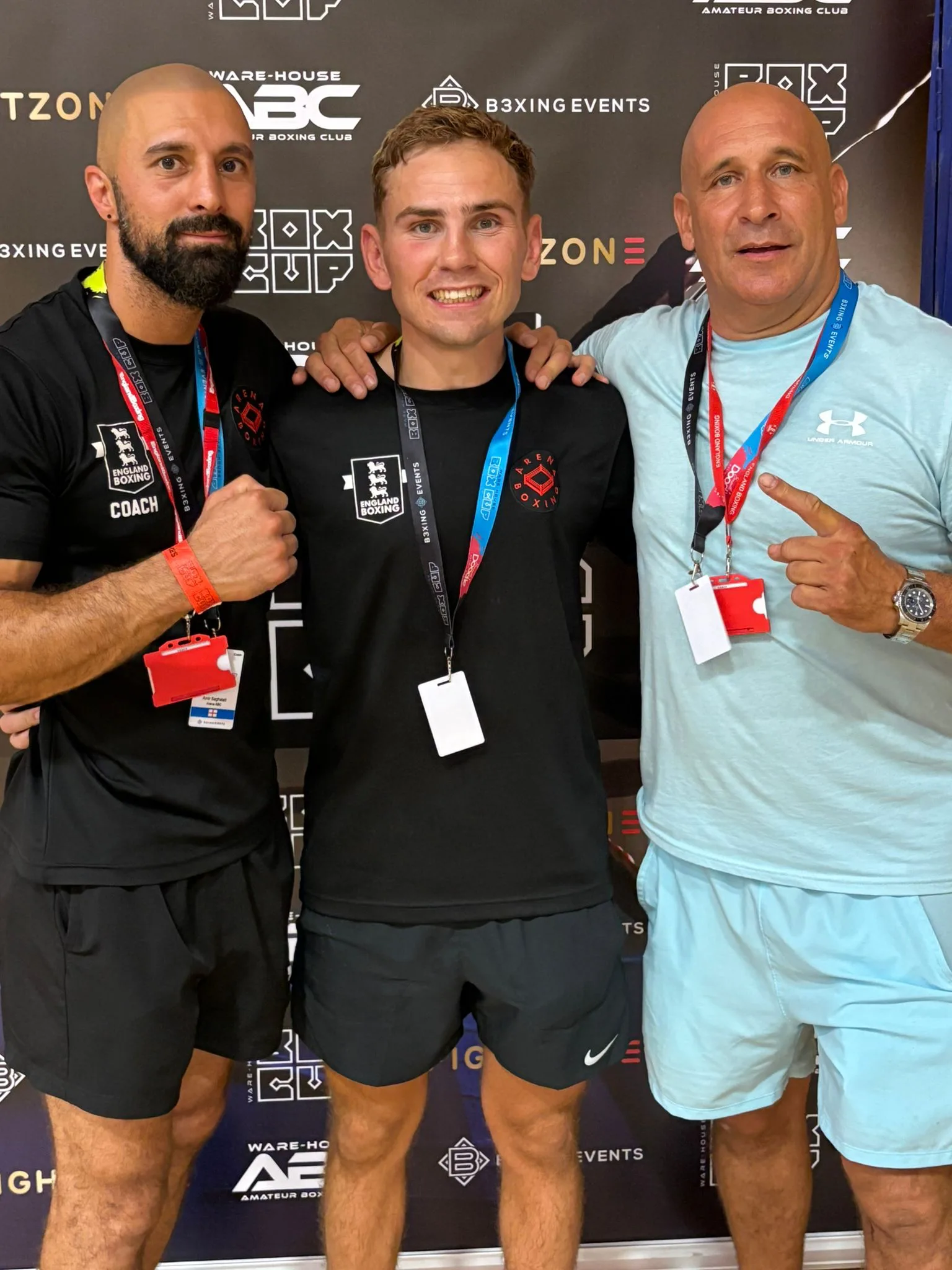 Current Arena boxer celebrating at the Box Cup with the coaching team